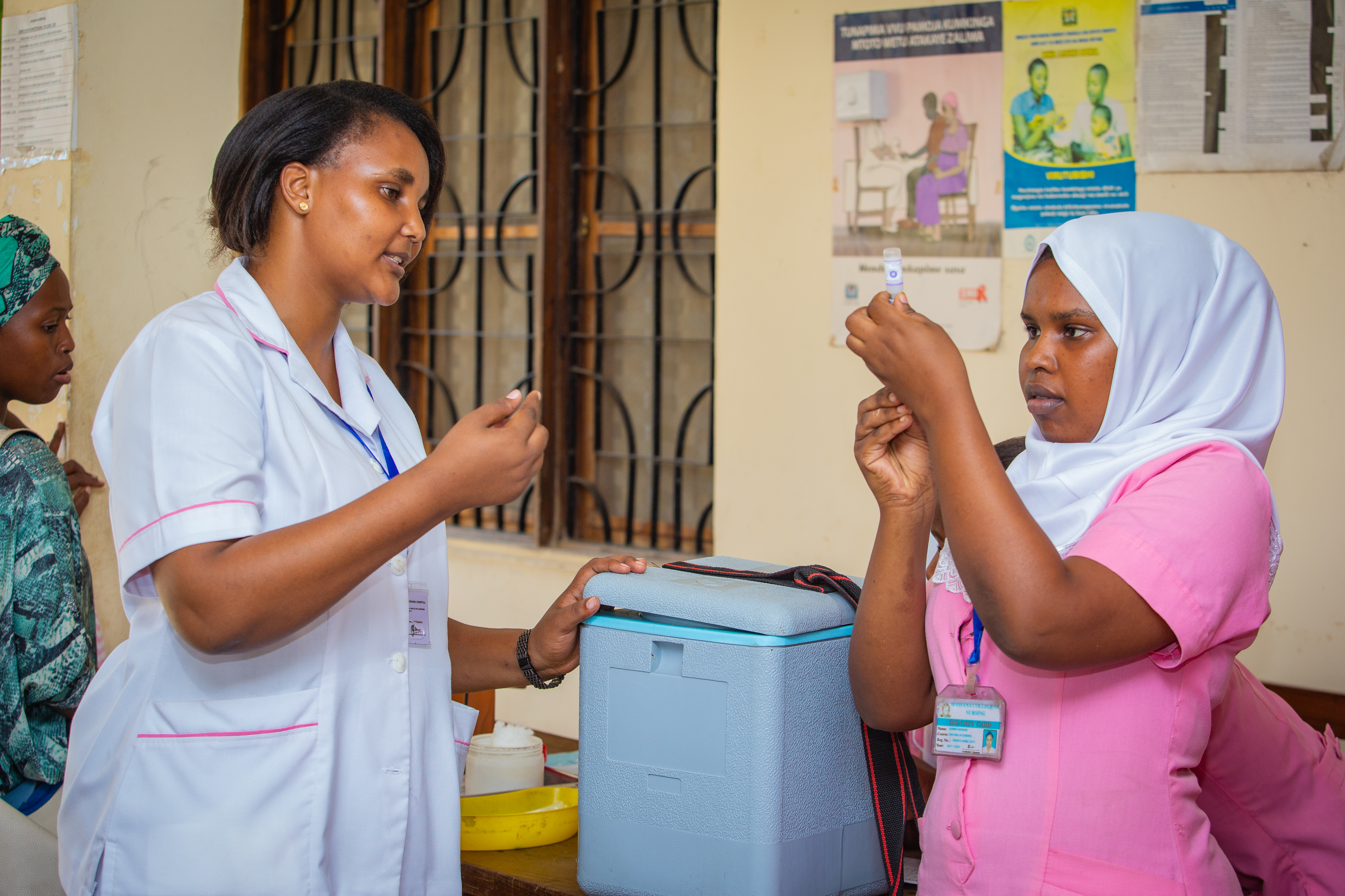  Two health workers in Tanzania.