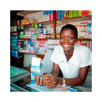 Image of a woman smiling behind a counter