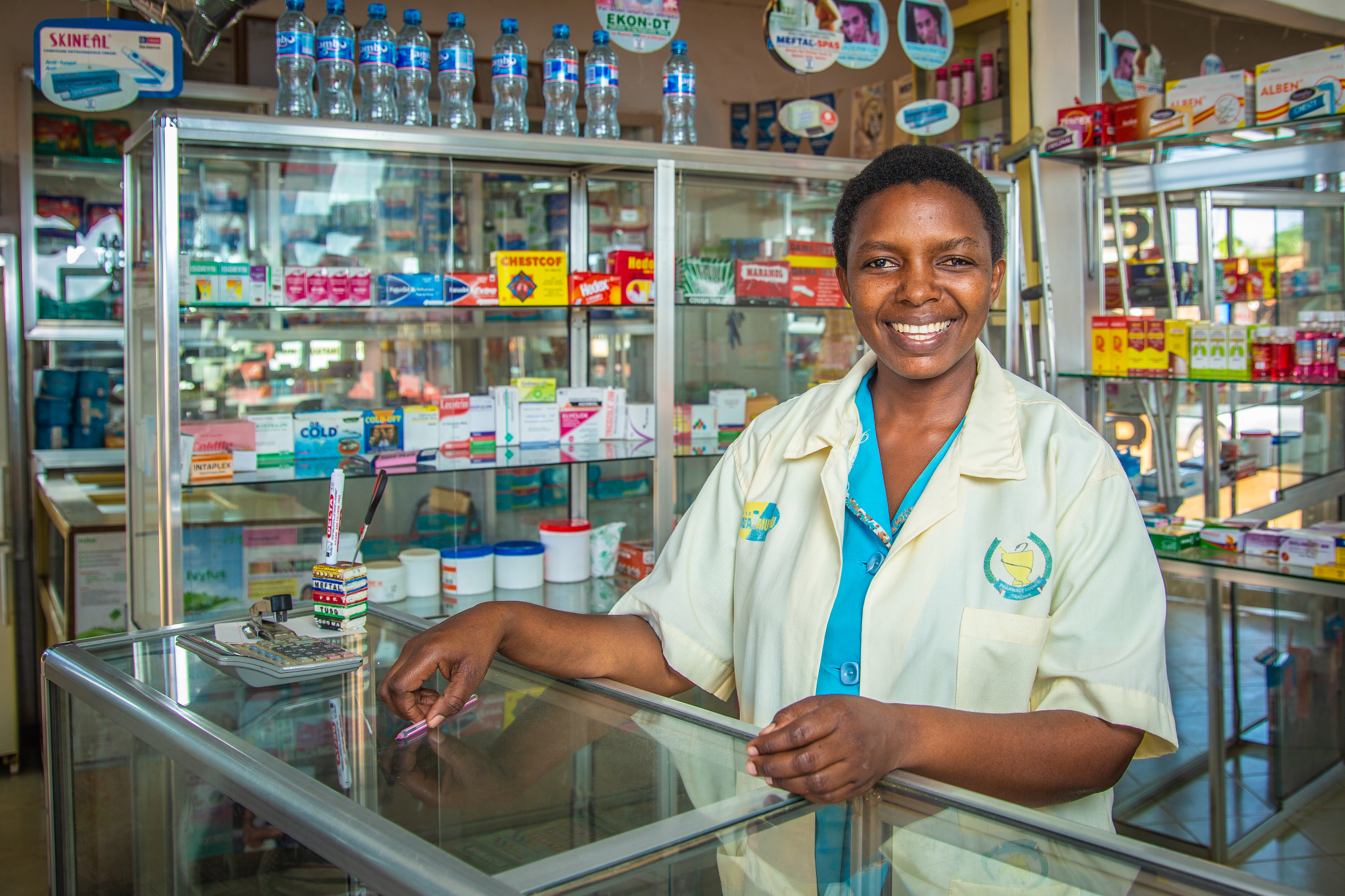 A female pharmacist in a drug shop