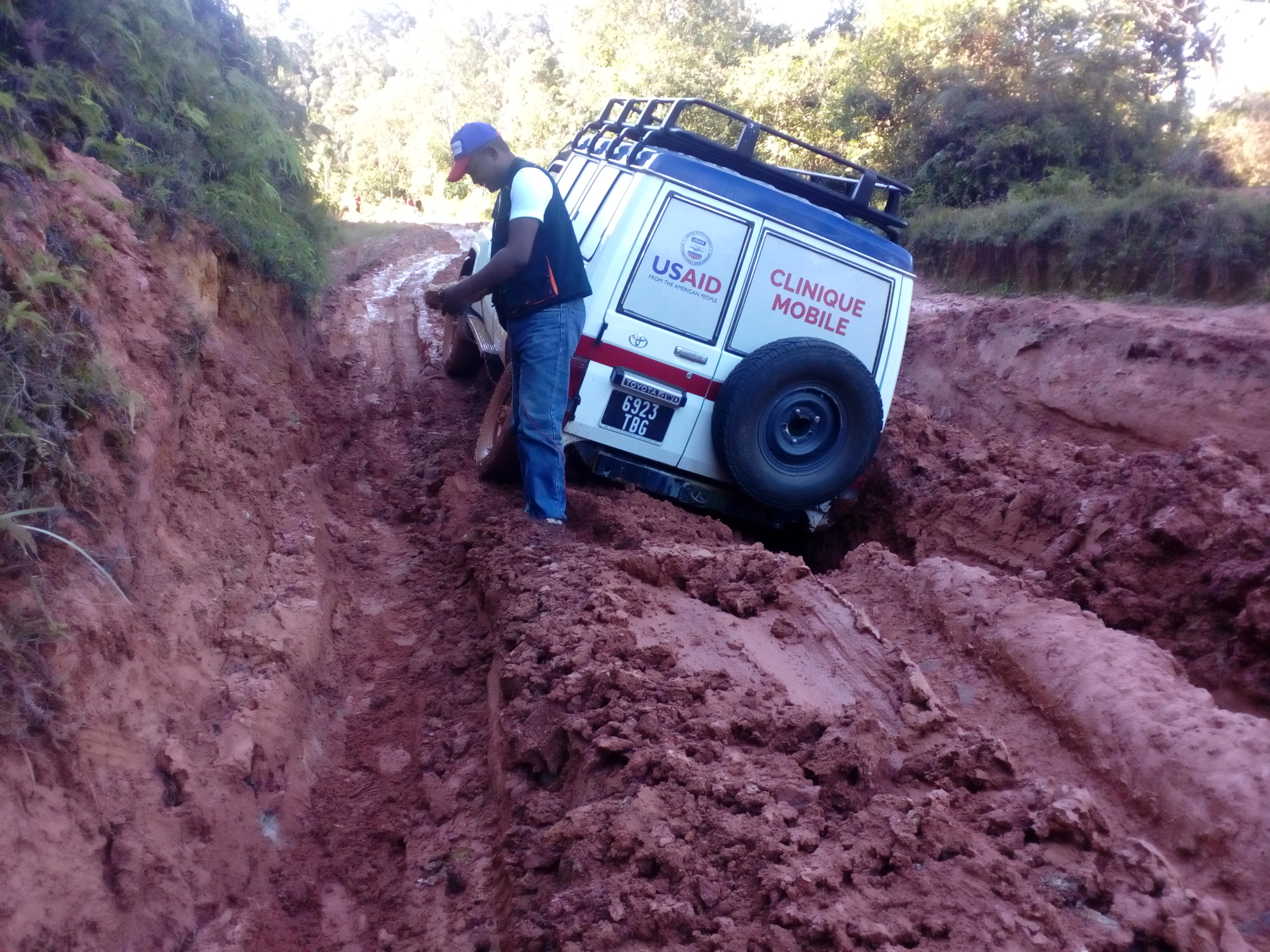 Mobile clinic vehicle stuck on a muddy road. 