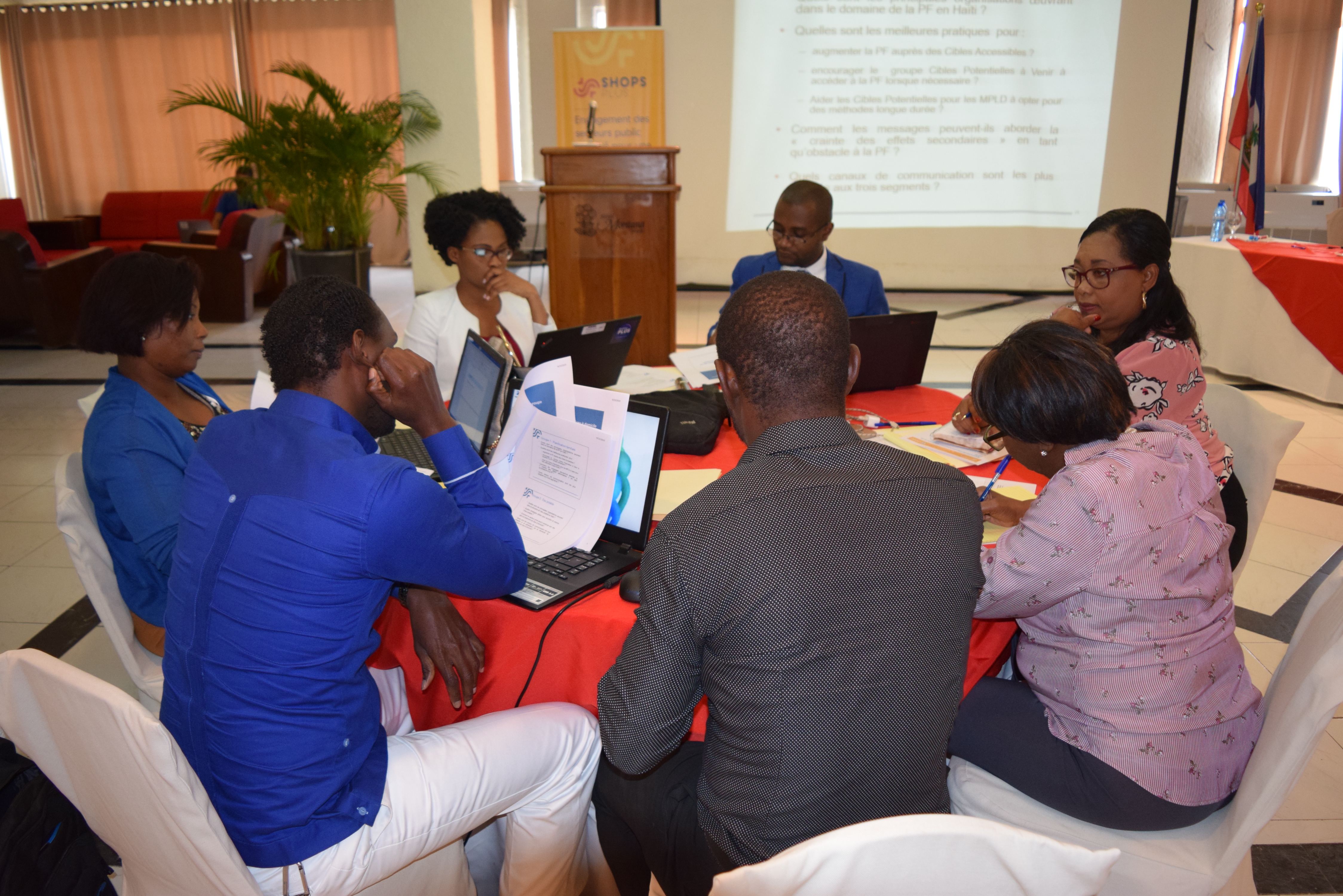 A group of participants sitting around a table during a breakout session during the workshop