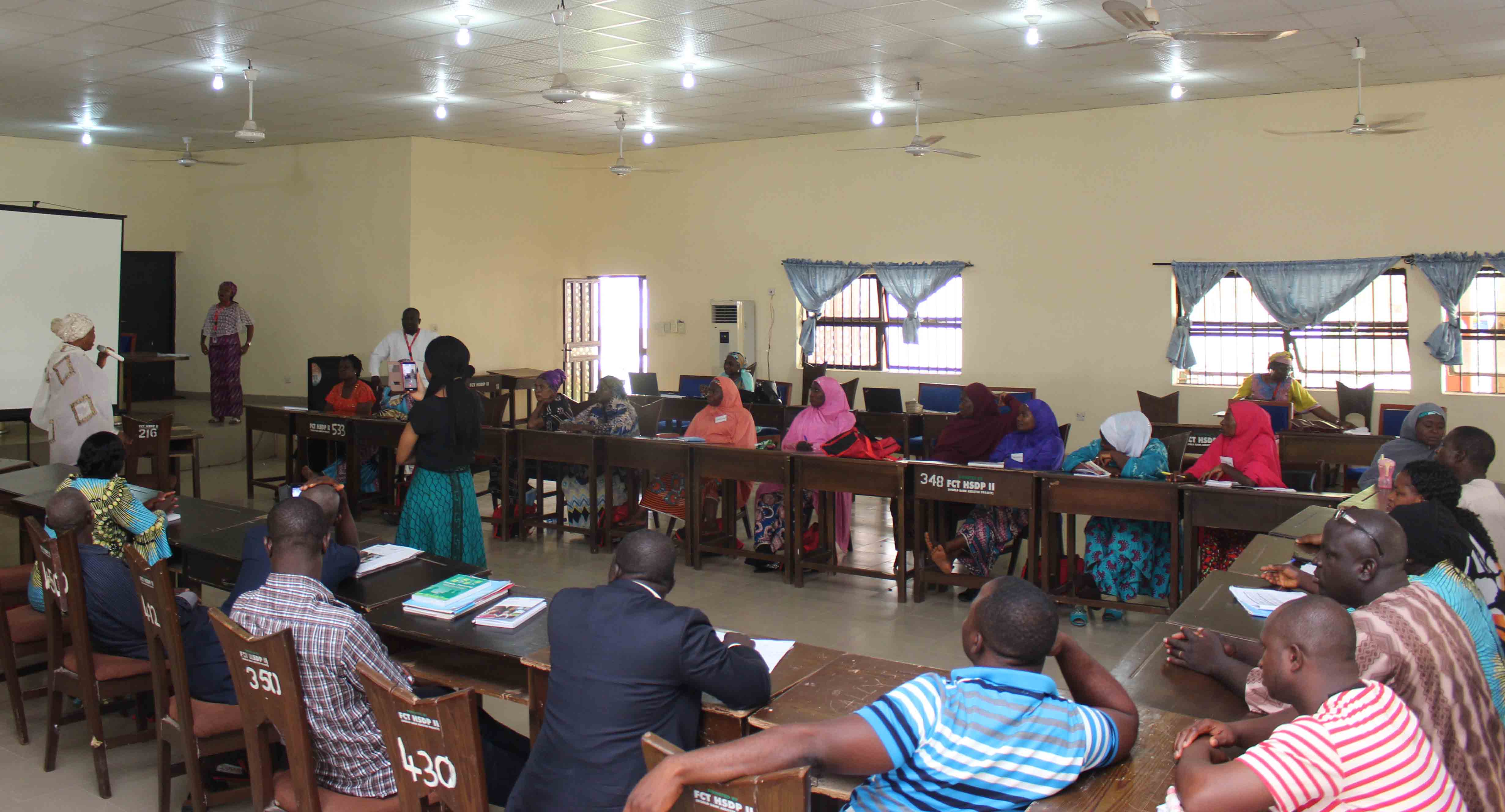 Participants seated around a table at a training in FCT, Nigeria