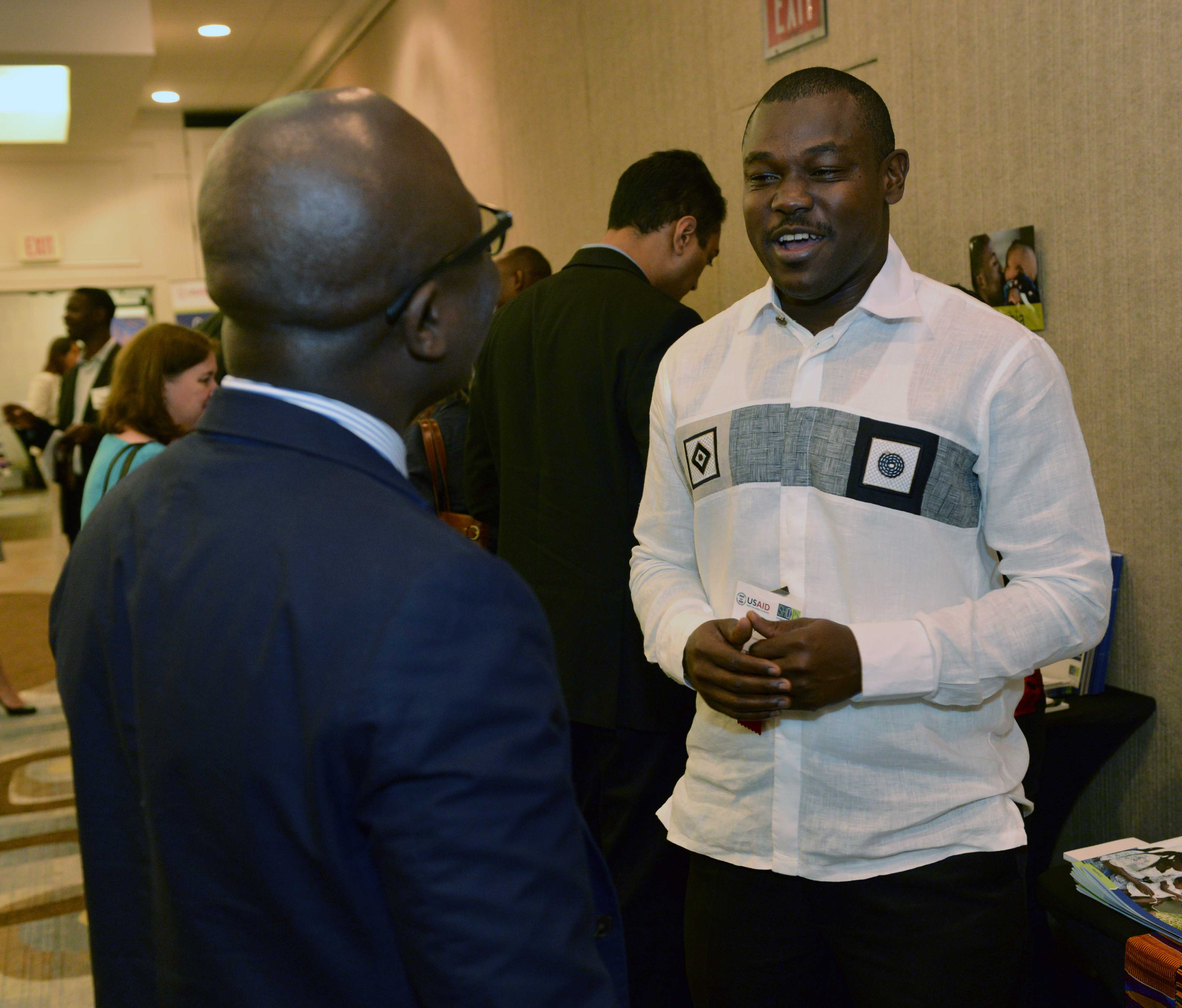 Joseph Addo-Yobo talks to a meeting attendee