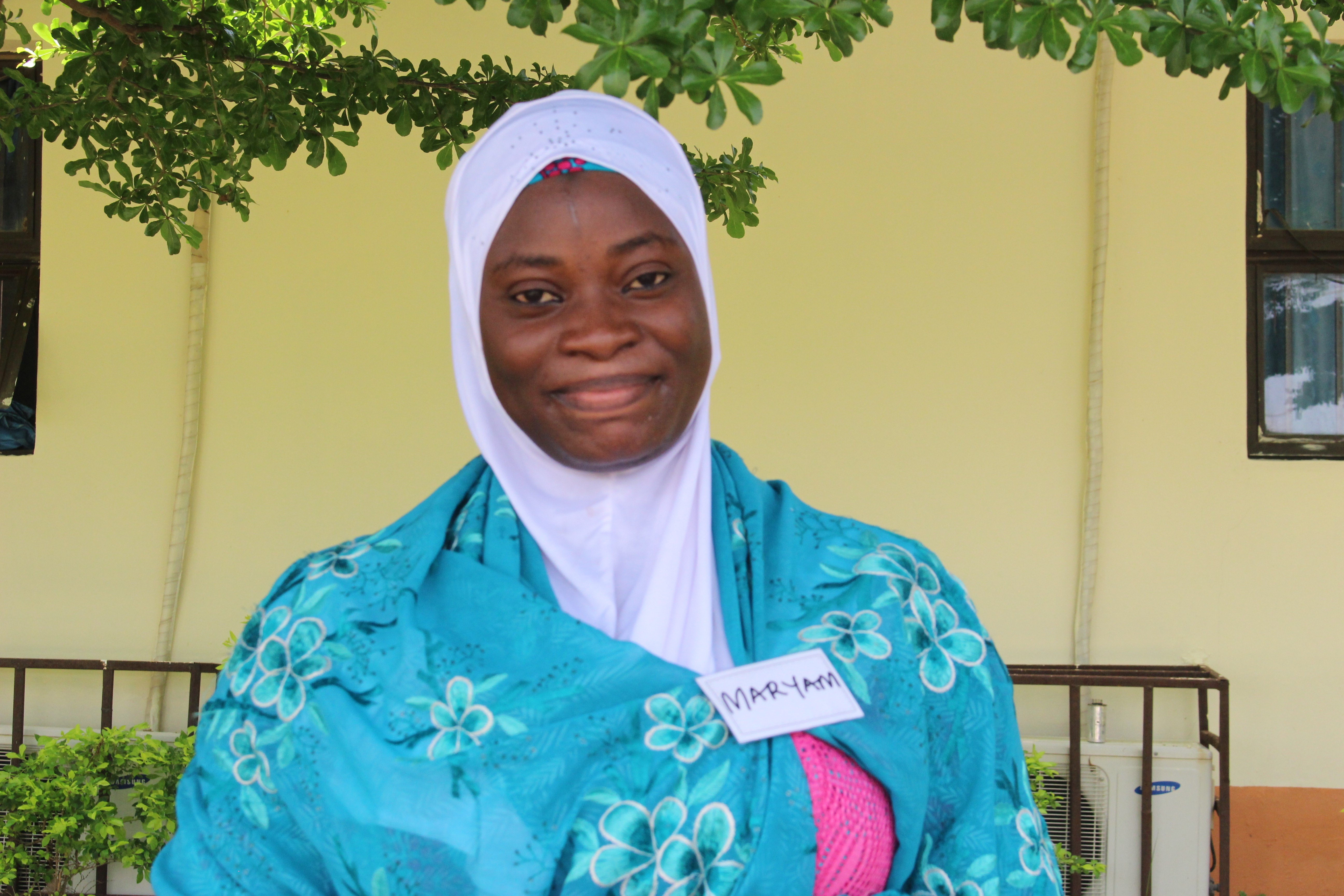 Mariam Hassan smiles for the camera following a training session.