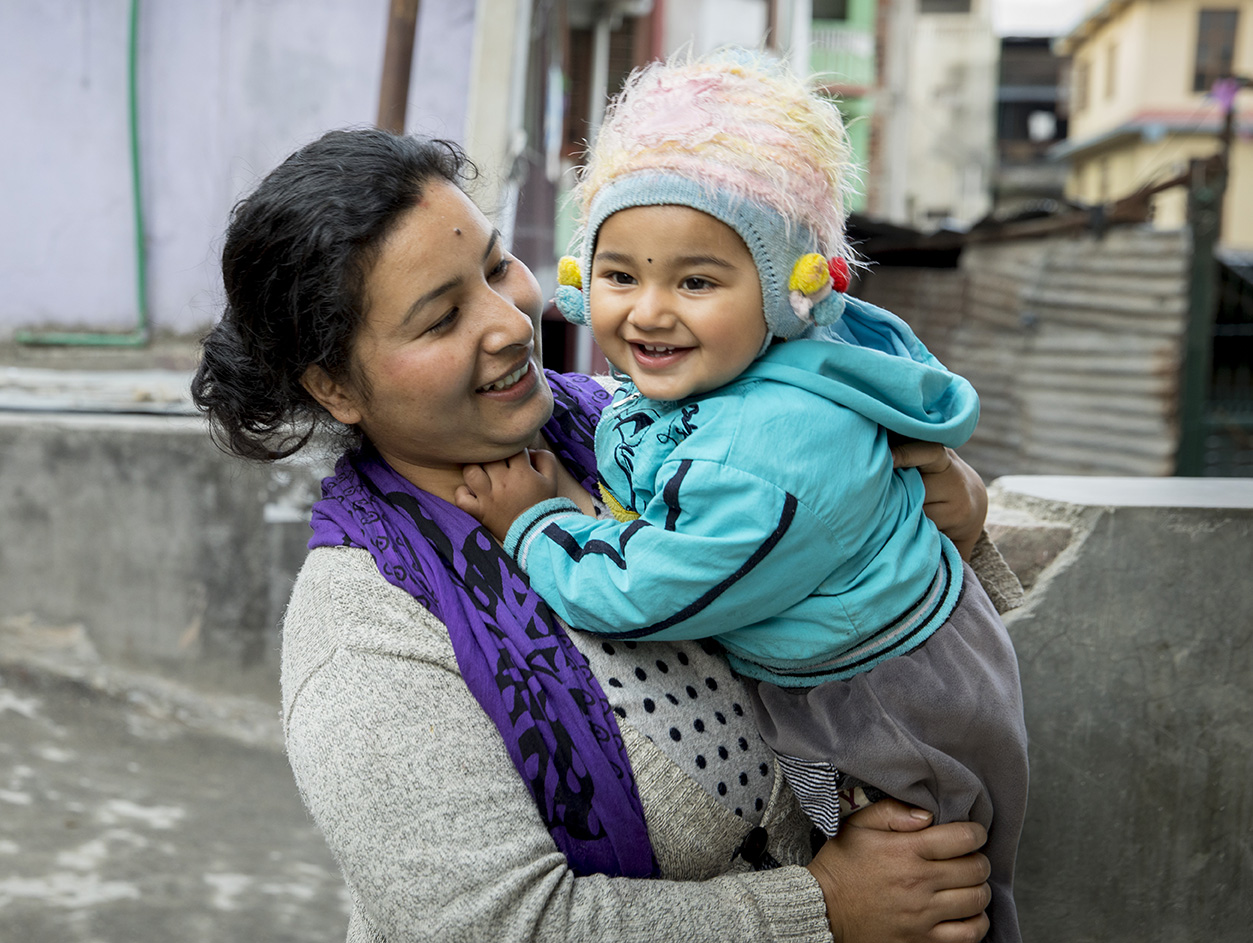 Nepalese mom holding her baby