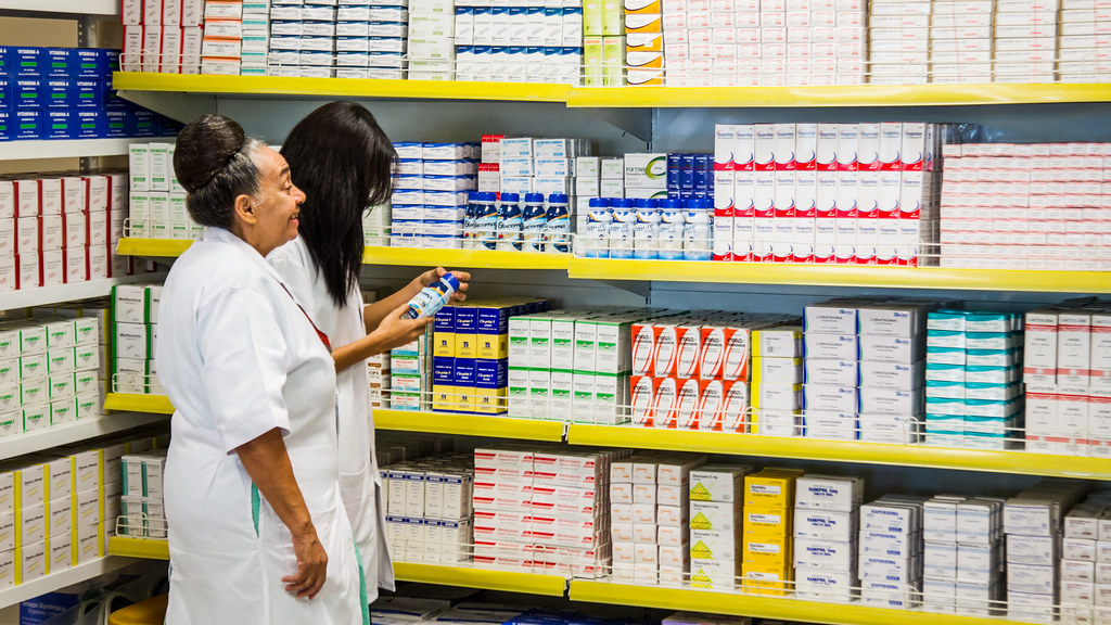 Two female Pharmacists in a storeroom
