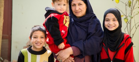 An Afghan mother with her three children.