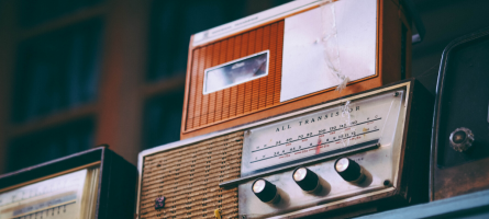 Old radio on a shelf. 