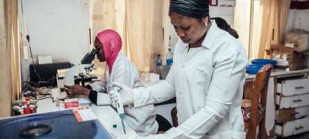 Two female lab technicians test sputum samples from presumptive TB patients in a networked laboratory in Kano state. 