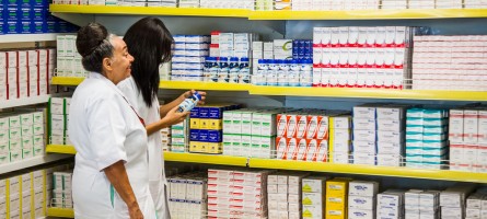 Two female pharmacists in a store room