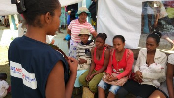 SHOPS Plus staff counseling a group of women. 