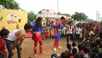 Actors dressed in superhero costumes as part of a skit on ORS and zinc as a treatment for diarrhea. 