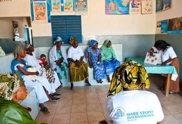 A group of women participate in a group counseling session in Senegal
