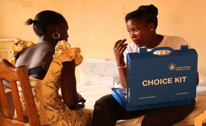 A woman receives family planning counseling at a Blue Star franchise in Senegal